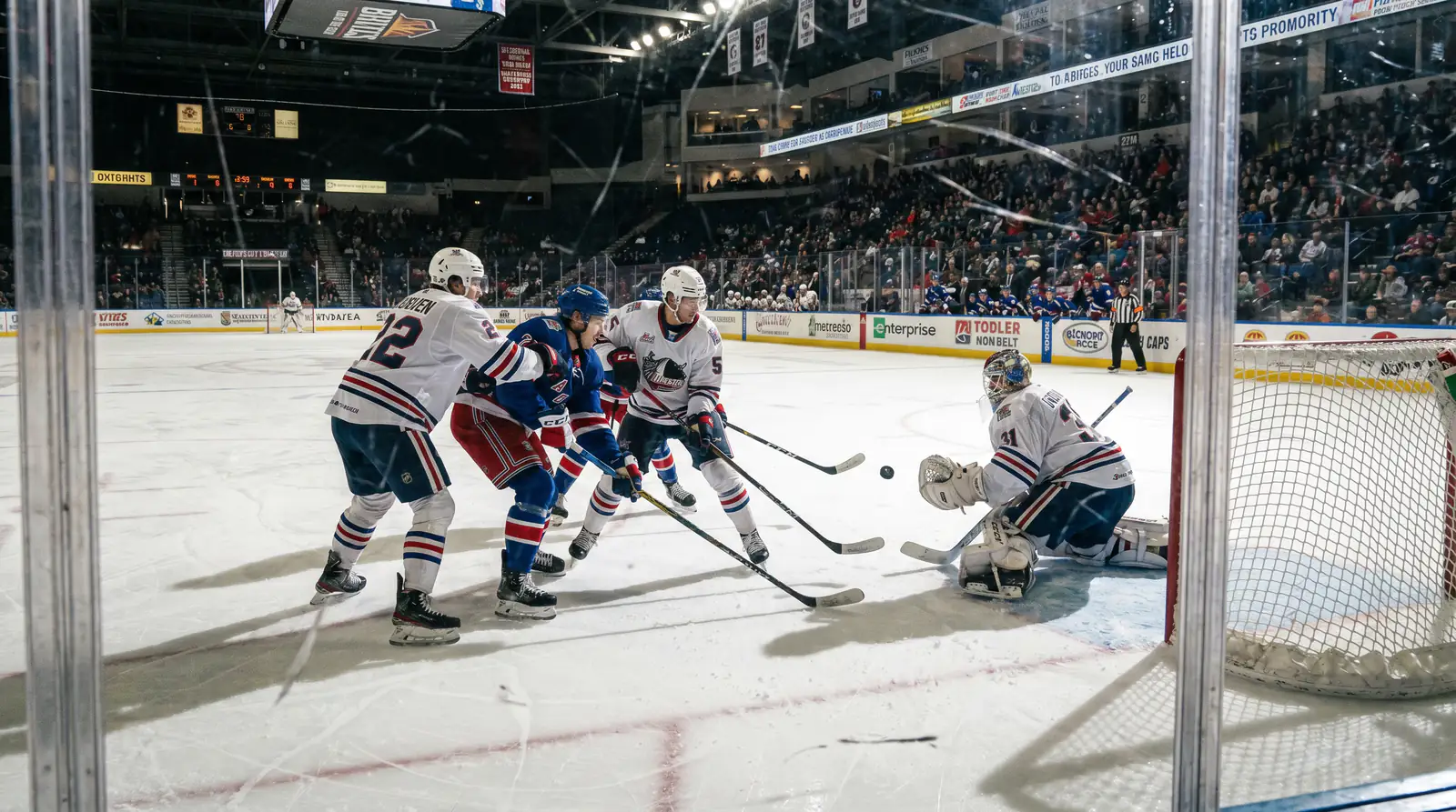 Hockey defencemen defending during late third period action