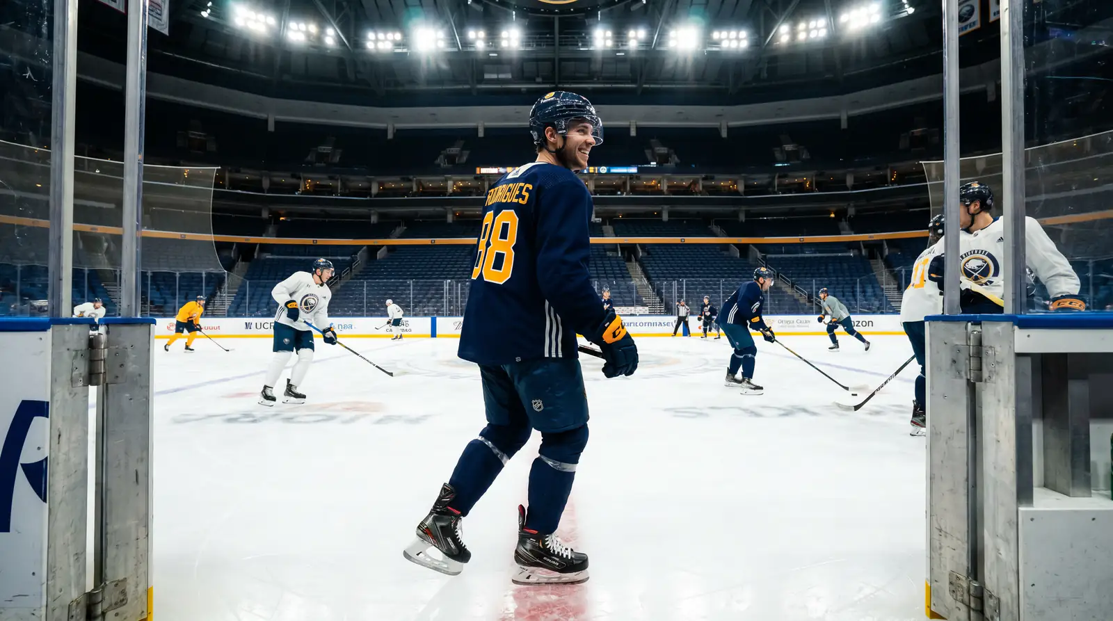 Newly acquired NHL player in his new team jersey stepping onto the ice for his first practice