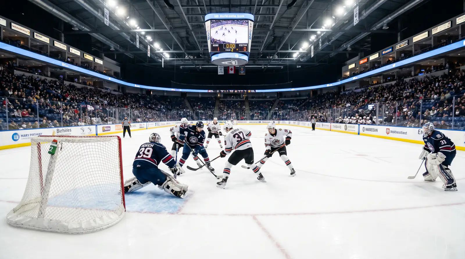Low-scoring hockey game with both goaltenders in position during a defensive play
